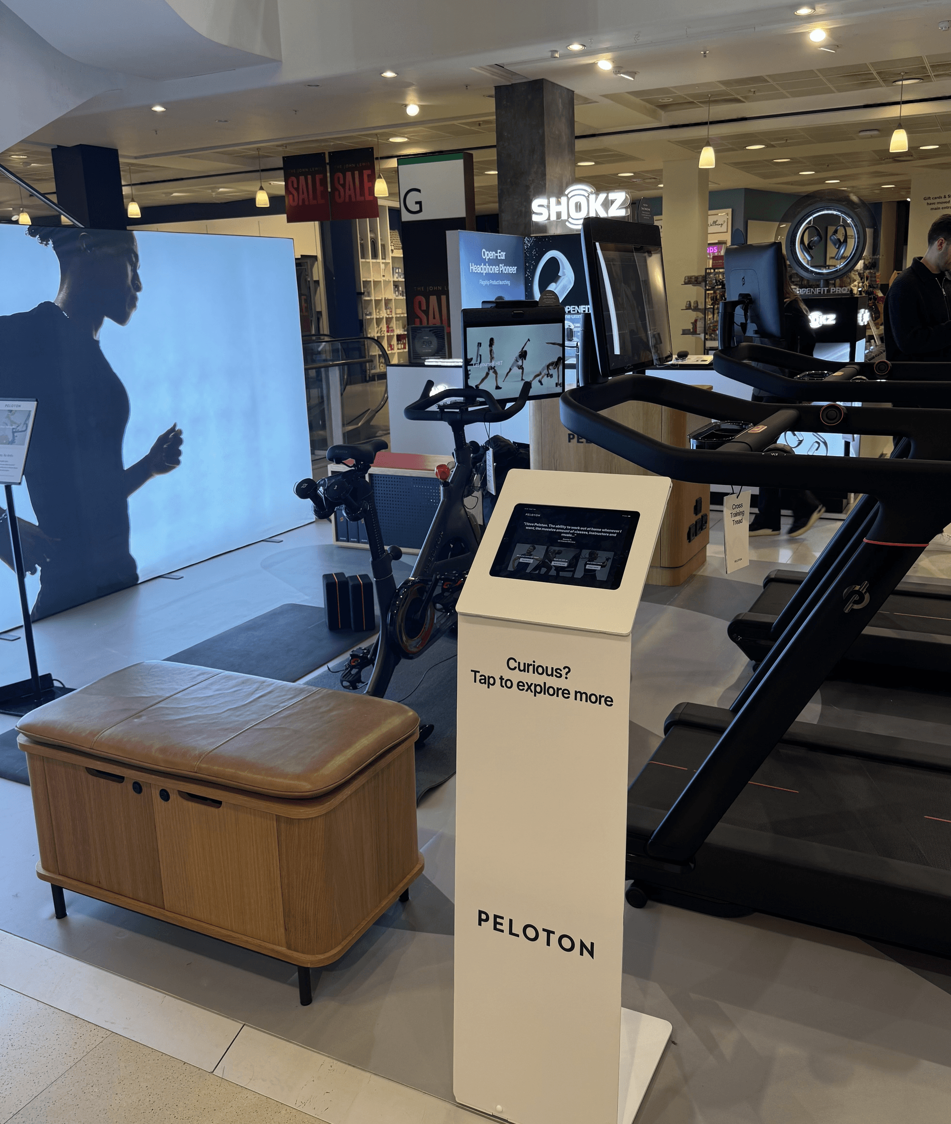 Peloton UK pop-up touchscreen kiosk in retail environment